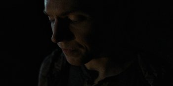 Movie still from “Blair Witch” (2016), directed by Adam Wingard – A man is looking into the light in the dark; Extreme Close Up shot, Low angle