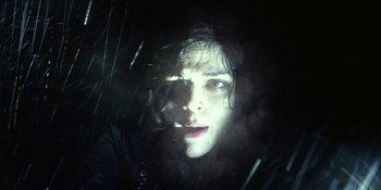 Movie still from “Blair Witch” (2016), directed by Adam Wingard – A woman with long dark curly hair looking at the camera; Close Up shot, Low angle