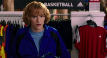 Movie still from “Blended” (2014), directed by Frank Coraci – A woman in a blue jacket is looking at the camera; Close Up shot, Over the shoulder angle