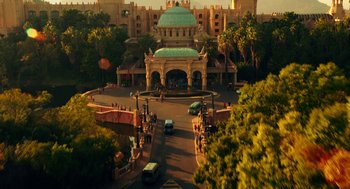 Movie still from “Blended” (2014), directed by Frank Coraci – An aerial view of a street with cars driving down the road; Extreme Wide shot, High angle