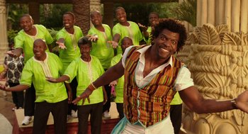 Movie still from “Blended” (2014), directed by Frank Coraci – A group of men in green shirts and a man in a white shirt; Medium shot, Low angle