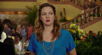 Movie still from “Blended” (2014), directed by Frank Coraci – A woman in a blue shirt and a bunch of gold necklaces; Close Up shot, Over the shoulder angle