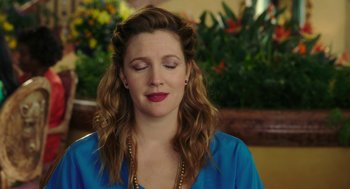 Movie still from “Blended” (2014), directed by Frank Coraci – A woman with her eyes closed and her eyes closed with her eyes closed; Close Up shot, Over the shoulder angle