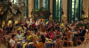 Movie still from “Blended” (2014), directed by Frank Coraci – A group of people sitting at a table with food; Extreme Wide shot, High angle