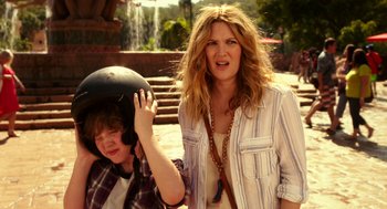 Movie still from “Blended” (2014), directed by Frank Coraci – A woman and a boy wearing a helmet; Medium shot, Over the shoulder angle