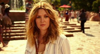 Movie still from “Blended” (2014), directed by Frank Coraci – A beautiful woman with long blonde hair wearing a striped shirt; Close Up shot, Over the shoulder angle