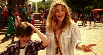Movie still from “Blended” (2014), directed by Frank Coraci – A woman standing next to a boy near a waterfall; Medium shot, Over the shoulder angle