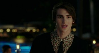 Movie still from “Blended” (2014), directed by Frank Coraci – A young man wearing a black jacket and a floral shirt; Close Up shot, Over the shoulder angle