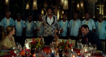 Movie still from “Blended” (2014), directed by Frank Coraci – A group of men standing in front of a dinner table; Wide shot, Over the shoulder angle