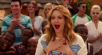 Movie still from “Blended” (2014), directed by Frank Coraci – A woman with her hands over her mouth; Close Up shot, Over the shoulder angle