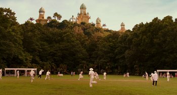 Movie still from “Blended” (2014), directed by Frank Coraci – A group of men playing a game of cricket; Extreme Wide shot, High angle
