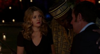 Movie still from “Blended” (2014), directed by Frank Coraci – A man and a woman standing next to each other in front of another man; Close Up shot, Over the shoulder angle