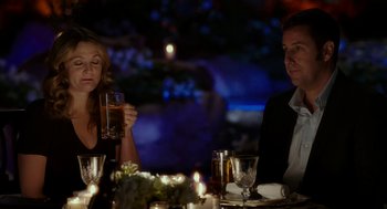 Movie still from “Blended” (2014), directed by Frank Coraci – A man and a woman sitting at a dinner table; Medium shot, Over the shoulder angle
