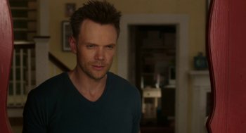 Movie still from “Blended” (2014), directed by Frank Coraci – A person in a room near a door; Close Up shot, Over the shoulder angle