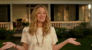 Movie still from “Blended” (2014), directed by Frank Coraci – A woman standing in front of a white house; Medium shot, Low angle