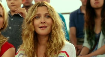 Movie still from “Blended” (2014), directed by Frank Coraci – A person with long blonde hair; Close Up shot, Over the shoulder angle