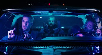 Movie still from “Blindspotting” (2018), directed by Carlos López Estrada – Two men in the back seat of a car; Medium shot, Low angle