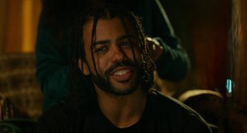 Movie still from “Blindspotting” (2018), directed by Carlos López Estrada – A person with dreadlocks; Close Up shot, Over the shoulder angle