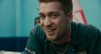 Movie still from “Blindspotting” (2018), directed by Carlos López Estrada – A person with a cigarette in his mouth; Close Up shot, Over the shoulder angle