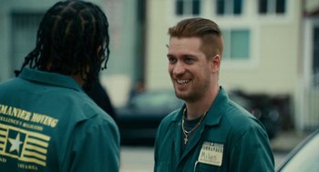 Movie still from “Blindspotting” (2018), directed by Carlos López Estrada – A man in a green shirt is talking to another man in a green shirt; Close Up shot, Over the shoulder angle