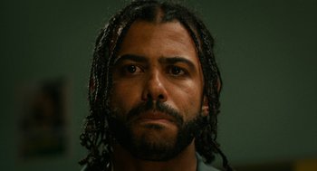 Movie still from “Blindspotting” (2018), directed by Carlos López Estrada – A person with a beard; Close Up shot, Low angle
