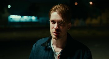 Movie still from “Blindspotting” (2018), directed by Carlos López Estrada – A person wearing a jacket; Close Up shot, Low angle