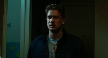 Movie still from “Blindspotting” (2018), directed by Carlos López Estrada – A person wearing a jacket with blood on it; Close Up shot, Low angle