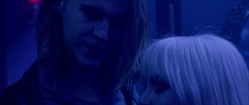 Movie still from “Bliss” (2019), directed by Joe Begos – A man and a woman are looking at one another; Close Up shot, Low angle