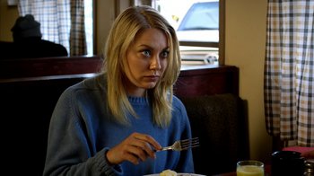 Movie still from “Blue Jay” (2016), directed by Alex Lehmann – A woman sitting at a table with a fork in her hand; Close Up shot, Over the shoulder angle