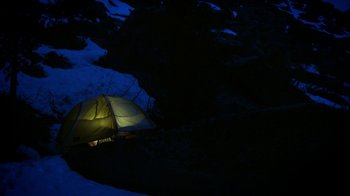 Movie still from “Blue Jay” (2016), directed by Alex Lehmann – A tent is lit up at night in the dark; Extreme Wide shot, High angle
