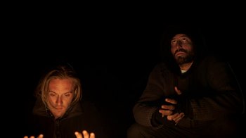 Movie still from “Blue Jay” (2016), directed by Alex Lehmann – Two men sitting in the dark with their hands up; Medium shot, Low angle
