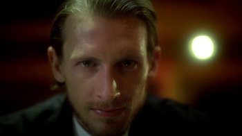 Movie still from “Blue Jay” (2016), directed by Alex Lehmann – A person wearing a suit and tie; Close Up shot, Low angle