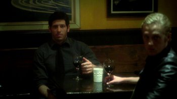 Movie still from “Blue Jay” (2016), directed by Alex Lehmann – A man sitting at a table with two glasses of wine; Medium shot, Over the shoulder angle