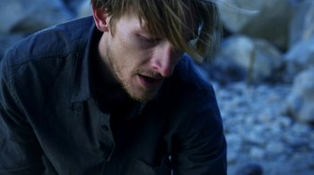Movie still from “Blue Jay” (2016), directed by Alex Lehmann – A person wearing a black shirt; Close Up shot, High angle