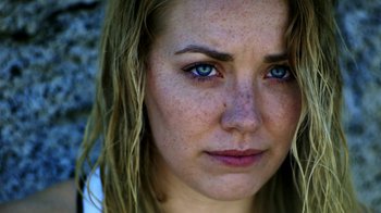 Movie still from “Blue Jay” (2016), directed by Alex Lehmann – A woman's face with blue eyes; Close Up shot, Low angle