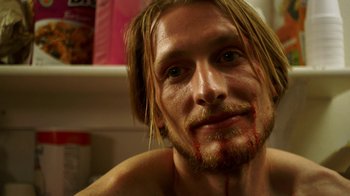 Movie still from “Blue Jay” (2016), directed by Alex Lehmann – A person with blood on his face; Close Up shot, High angle