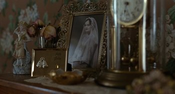 Movie still from “Bones and All” (2022), directed by Luca Guadagnino – An old photo of a woman in a wedding dress; Extreme Close Up shot, High angle