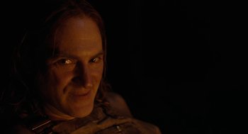 Movie still from “Bones and All” (2022), directed by Luca Guadagnino – A person wearing a brown jacket; Close Up shot, Over the shoulder angle