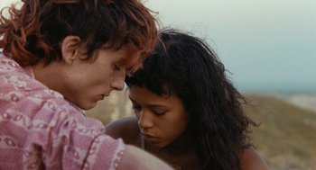 Movie still from “Bones and All” (2022), directed by Luca Guadagnino – A man and a woman looking at one another; Close Up shot, Over the shoulder angle