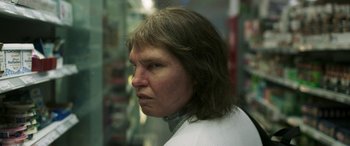 Movie still from “Border” (2018), directed by Ali Abbasi – A person with long brown hair; Close Up shot, Low angle