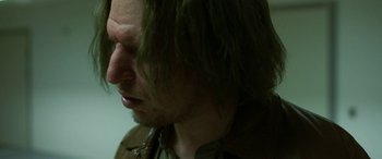 Movie still from “Border” (2018), directed by Ali Abbasi – A person with long green hair; Close Up shot, Over the shoulder angle