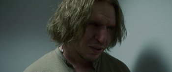 Movie still from “Border” (2018), directed by Ali Abbasi – A person with long brown hair; Close Up shot, Low angle