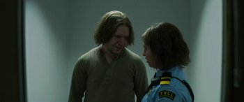 Movie still from “Border” (2018), directed by Ali Abbasi – A man and a woman talking to each other; Medium shot, Over the shoulder angle