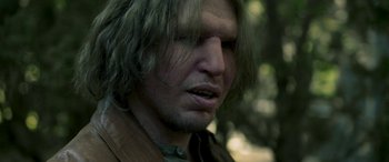 Movie still from “Border” (2018), directed by Ali Abbasi – A person with long hair; Close Up shot, Low angle