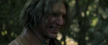 Movie still from “Border” (2018), directed by Ali Abbasi – A person with long hair; Close Up shot, Over the shoulder angle