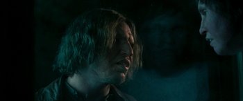 Movie still from “Border” (2018), directed by Ali Abbasi – A person with long brown hair; Close Up shot, Over the shoulder angle