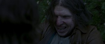Movie still from “Border” (2018), directed by Ali Abbasi – A person with long brown hair; Close Up shot, Over the shoulder angle