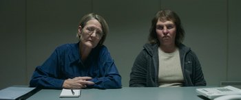 Movie still from “Border” (2018), directed by Ali Abbasi – Two women sitting at a table in front of each other; Medium shot, Over the shoulder angle