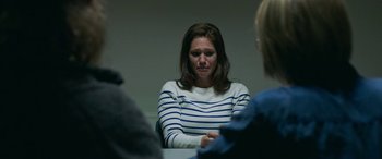 Movie still from “Border” (2018), directed by Ali Abbasi – A woman sitting in front of two other women; Close Up shot, Over the shoulder angle