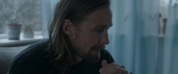 Movie still from “Border” (2018), directed by Ali Abbasi – A person with long hair; Close Up shot, Over the shoulder angle